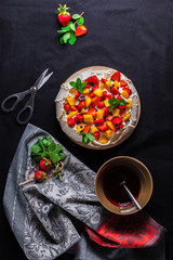 Pavlova cake on dark background. Top view. From above.