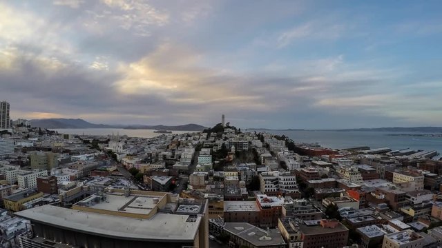 San Francisco, California, USA - April 24, 2016:  San Francisco cityscape dusk time lapse with zoom in.