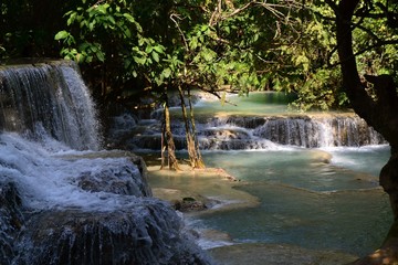 Waterfall into a oasis at Kung Si waterfalls in Laos