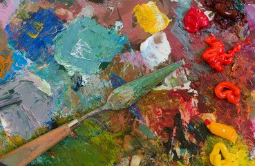 Oil paints and brush on palette. Abstract Background. Colorful t