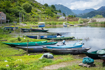 Fishermen rowing boats on a coast