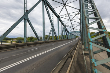 Fototapeta na wymiar Torun famous truss bridge over Vistula river. Transportation infrastructure.