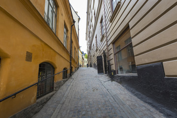 Colorful rustic Alley with Cobblestone road with a surrealistic