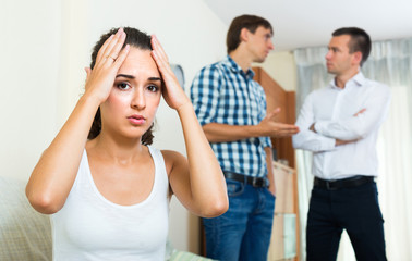 Two young men and unhappy girl