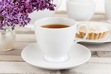 Obraz na płótnie Canvas Composition of white porcelain cup of tea