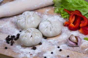 Caucasuan cuisine - Khinkali with meat served green koriander leaves