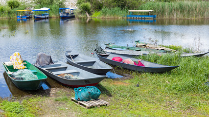 Fishermen rowing boats on a coast