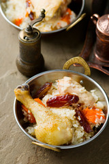 pilaf with chicken and pumpkin in a copper bowl