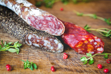 Three types of spanish sausages on wooden board