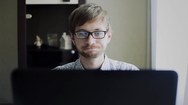 the tired student in front of the laptop