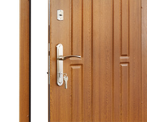 Obraz premium Open brown wooden door handle with lock.
