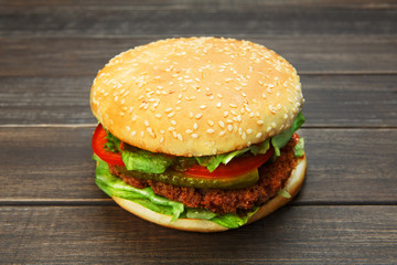 Meet and cheese burger at rustic wood