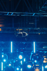 Drone flies over spotlight