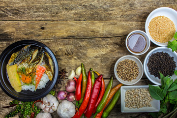 Salmon grilled fish, rice dishes with vegetables and spices in c