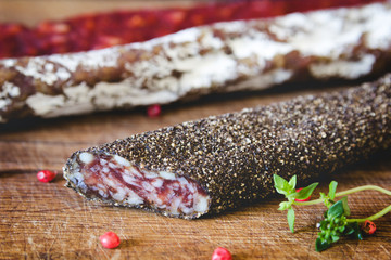 Three types of spanish sausages on wooden board