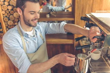 Handsome barista at cafe