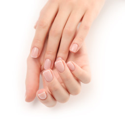 Woman hands with beautiful manicure isolated on white background