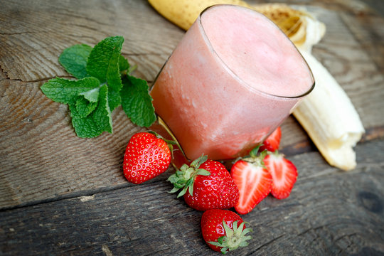 Freshly and healthy beverage (drink),  banana - strawberry smoothie in glass