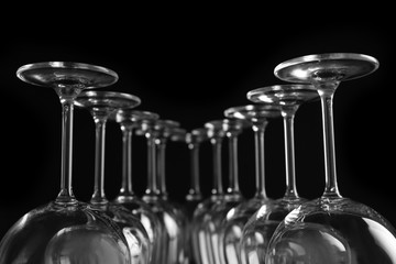 Empty wine glasses on black background, closeup
