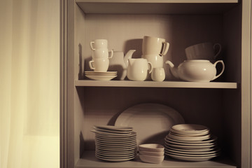 Dishes in cupboard in the kitchen