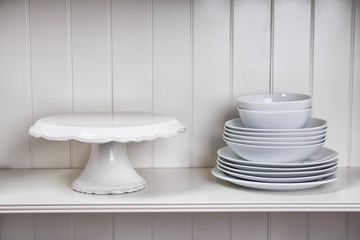 Dishes in cupboard in the kitchen