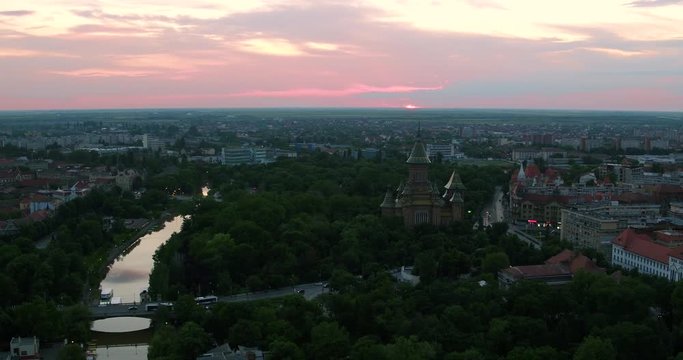 European city skyline at beautiful sunset and cloudy sky seen by a professional drone in 4K ultra HD