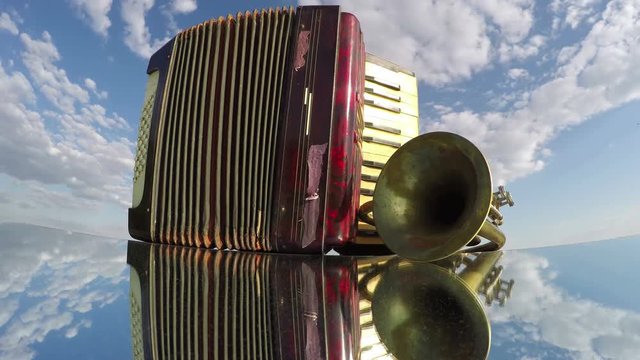 Old accordion and a trumpet on a mirror under cloudy sky on sunny day, time lapse 4K