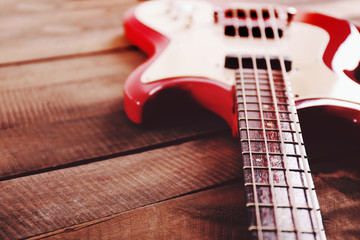 Electric guitar on wooden background