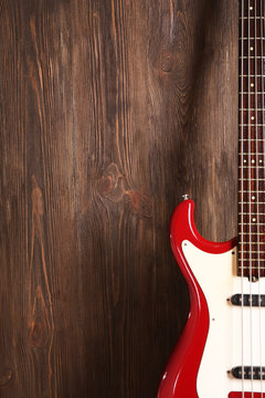 Electric guitar on wooden background