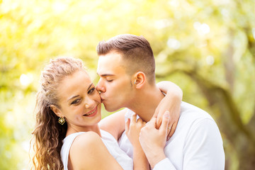 Young couple walking, Hyde Park, London: sunset colour tone