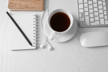 Office table with supplies and gadgets, top view