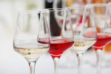Wine glasses with red and white wine, closeup