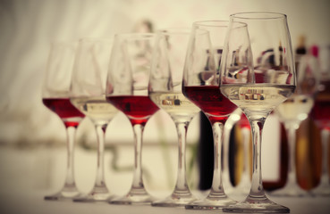 Wine glasses with red and white wine, closeup