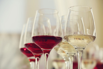 Wine glasses with red and white wine, closeup