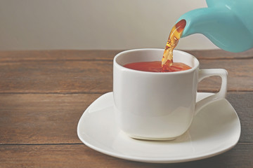 Cup of tea on wooden table