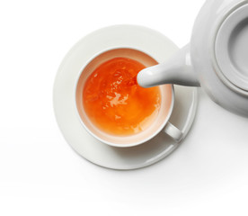 Cup of tea and teapot, isolated on white