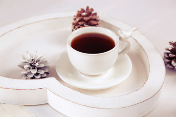 Beautiful winter composition with cup of hot drink