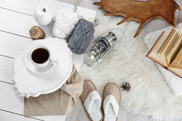 Cup of hot drink in living room. Comfortable winter weekend or holidays at home