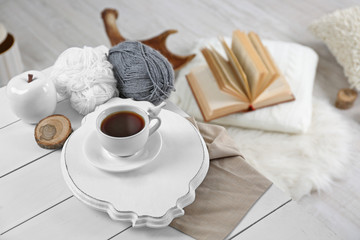 Cup of hot drink in living room. Comfortable winter weekend or holidays at home