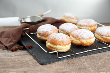 Fresh homemade donuts with powdered sugar, close up