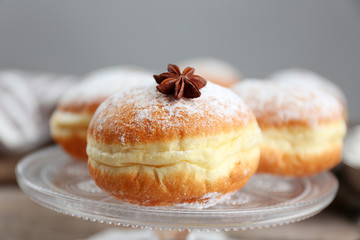 Fresh homemade donuts with powdered sugar, close up