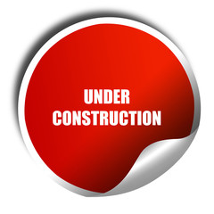 Under construction sign, 3D rendering, red sticker with white te