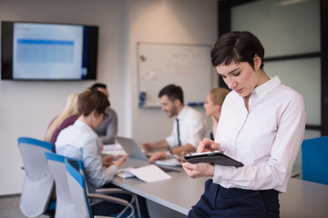 business woman on meeting  using tablet