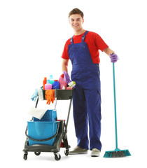 Young janitor with cleaner cart, isolated on white
