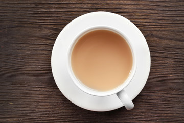 Fototapeta na wymiar Milk tea on wooden background.