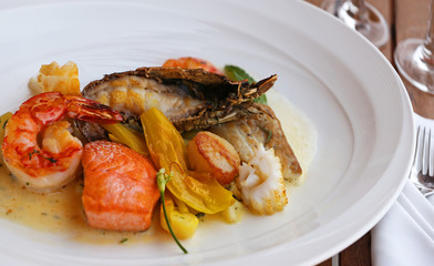 Seafood dish on a wooden table.