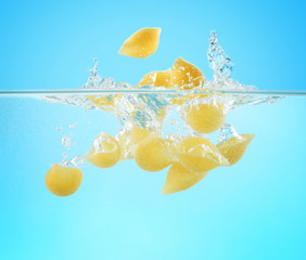 Fototapeta na wymiar Falling pasta in water