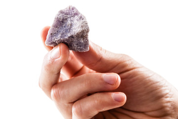 Holding a lepidolite piece