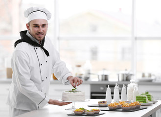 Male chef working at kitchen
