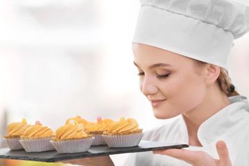 Female chef working at kitchen